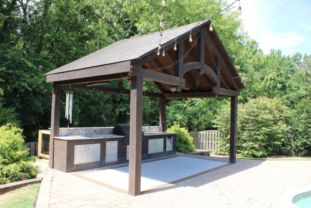 ACE Resin patio around outdoor kitchen and pool